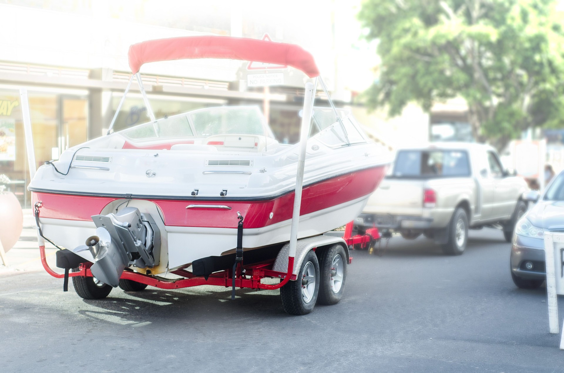 speedboat being towed by truck
